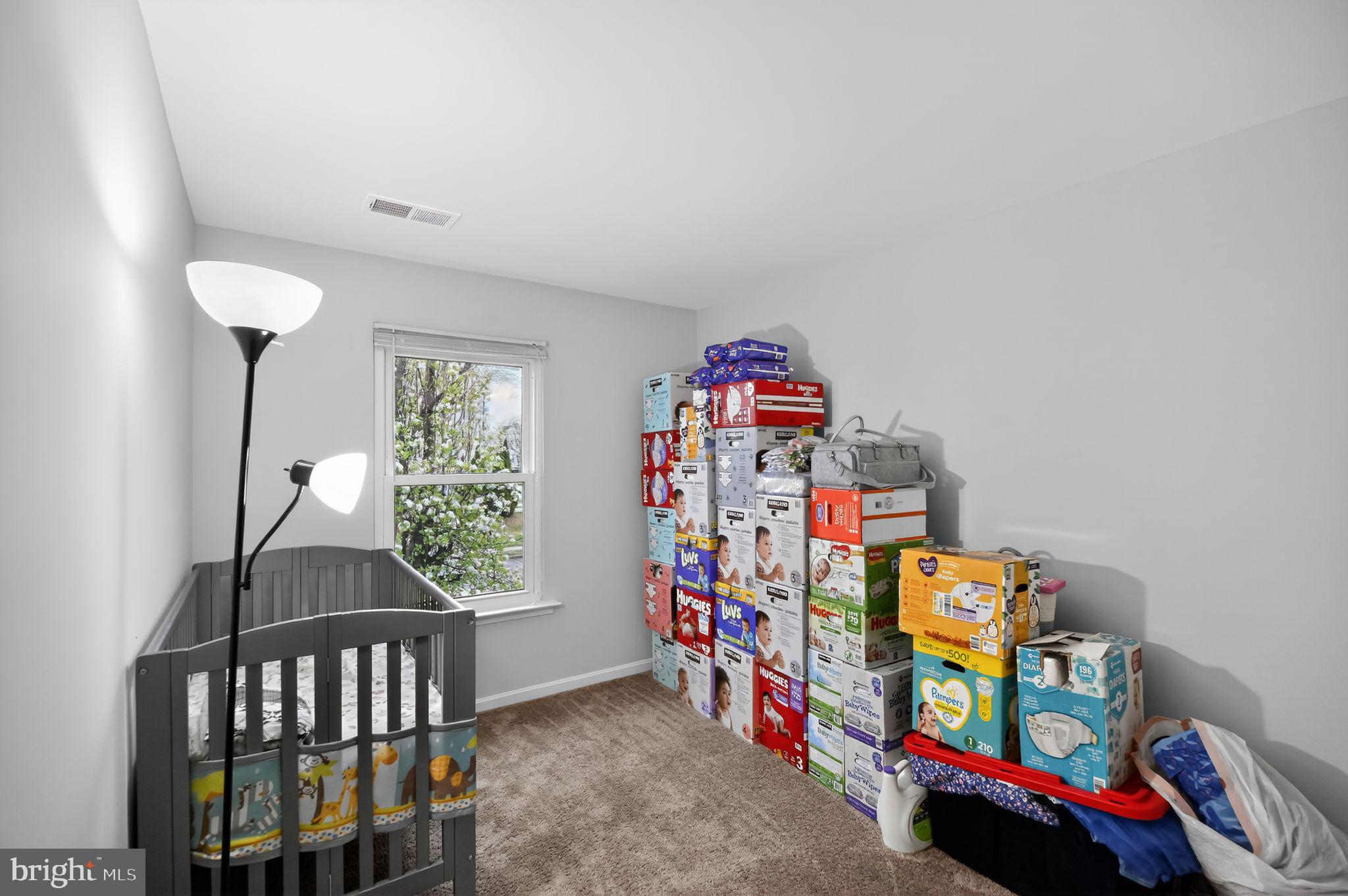17326 Sligo Loop Dumfries, VA 22026 - Photo 17 of 34 a children room with toys and a book shelf