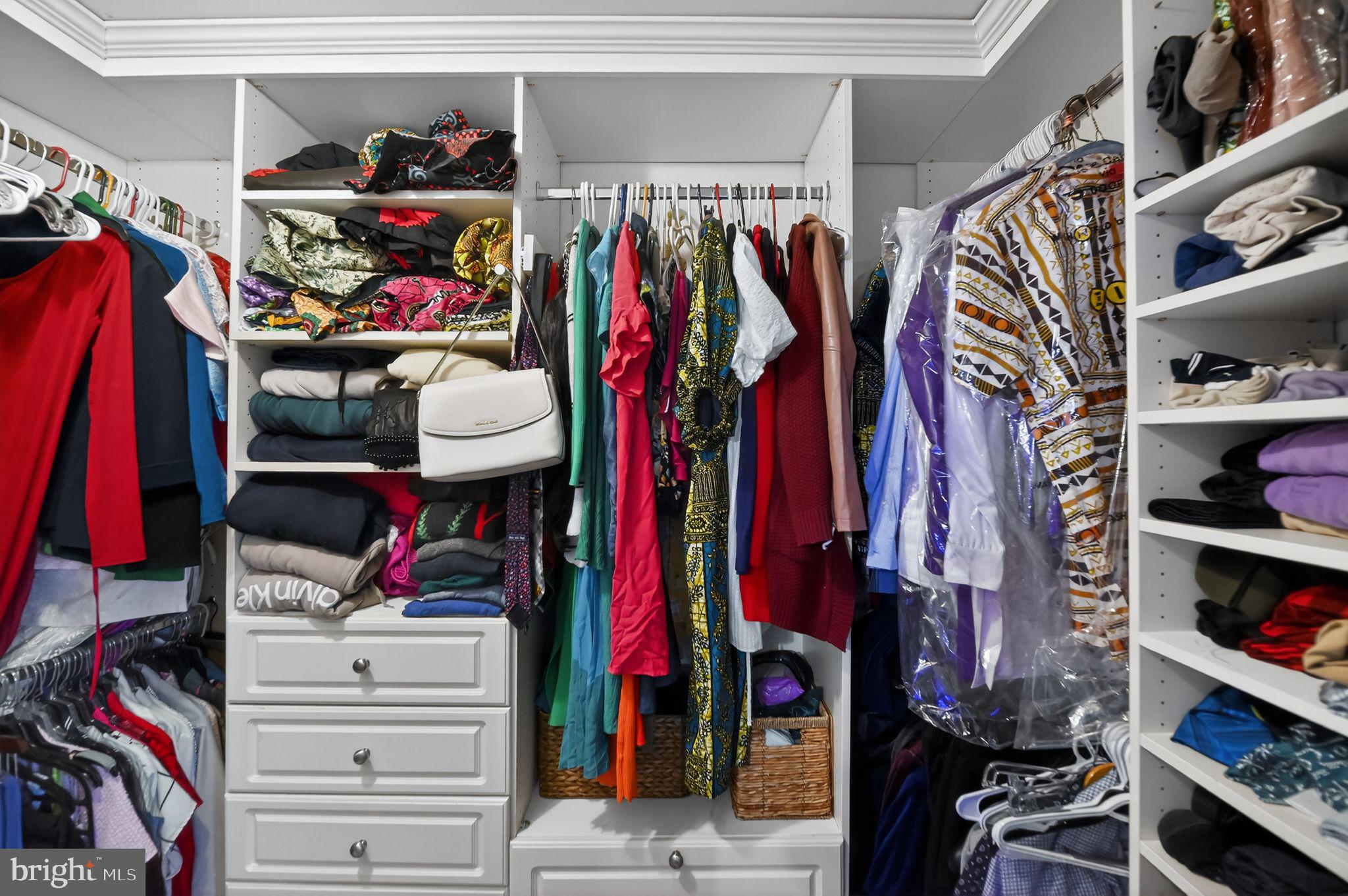 17326 Sligo Loop Dumfries, VA 22026 - Photo 26 of 34 a view of walk in closet with clothes and shoes