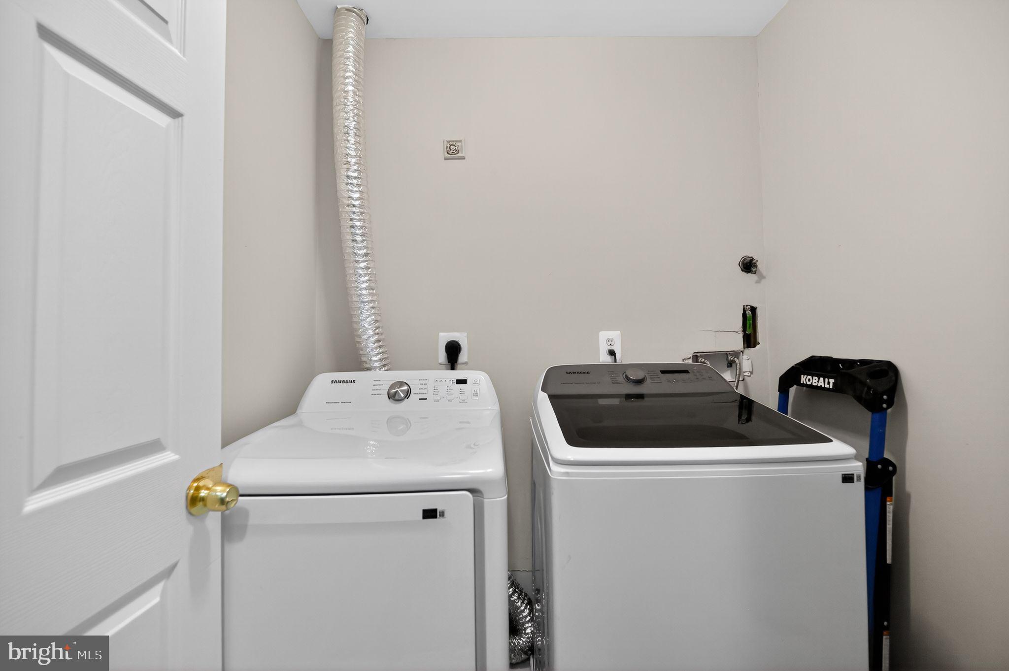 17326 Sligo Loop Dumfries, VA 22026 - Photo 28 of 34 a utility room with dryer and washer