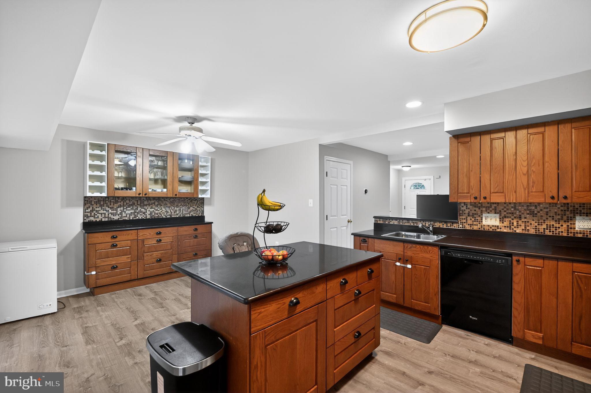 17326 Sligo Loop Dumfries, VA 22026 - Photo 3 of 34 a kitchen with stainless steel appliances granite countertop a sink stove and cabinets