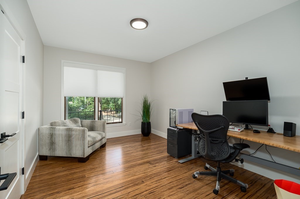 28 Grapevine Road Gloucester, MA 01930 - Photo 16 of 19 a view of a workspace with wooden floor and a window