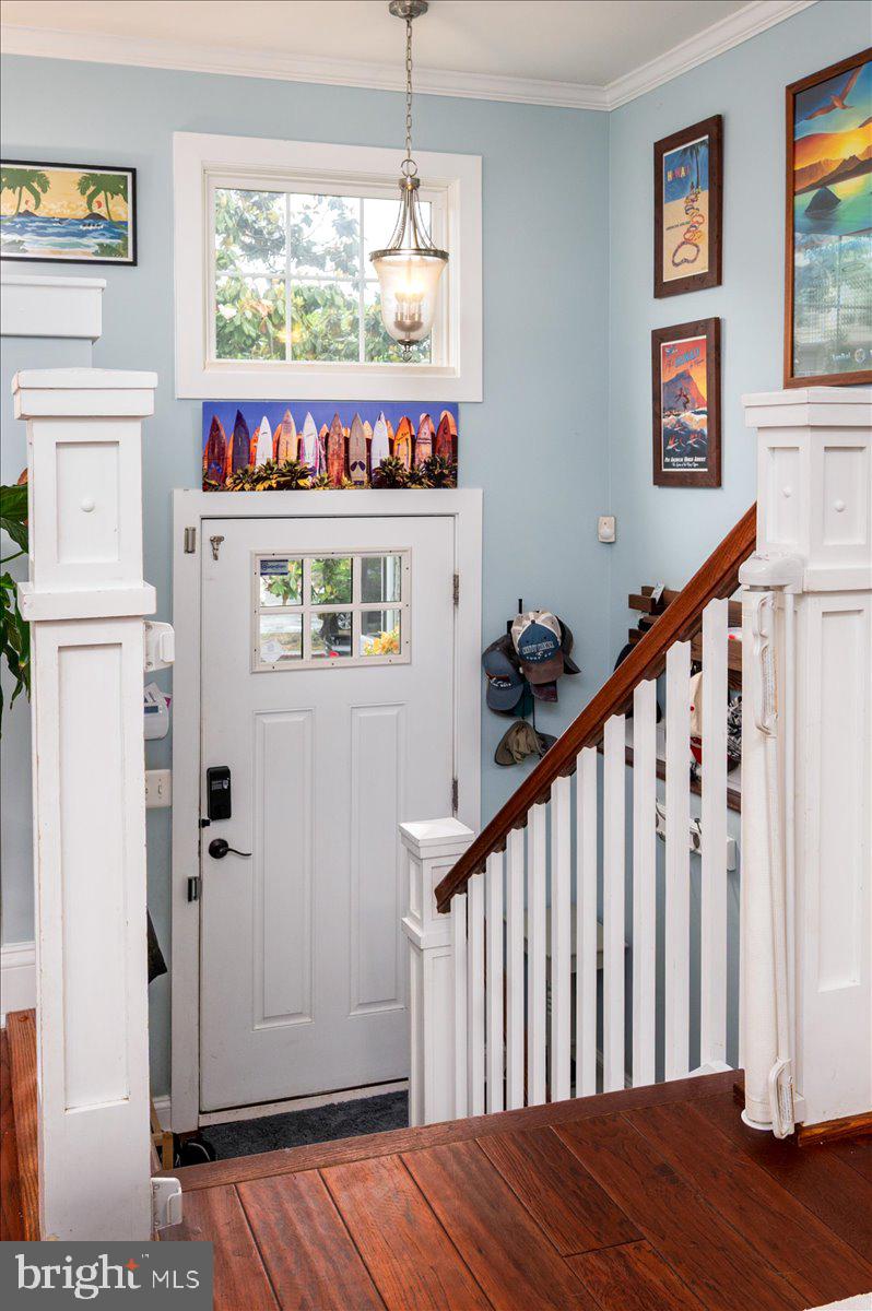 57 Spa Road Annapolis, MD 21401 - Photo 14 of 39 a view of a hallway with wooden floor and windows