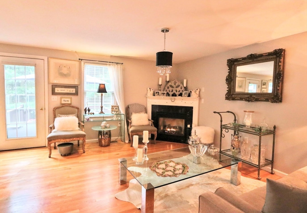 53 Lancaster Road, Unit 7 Clinton, MA 01510 - Photo 12 of 32 a living room with furniture and a fireplace