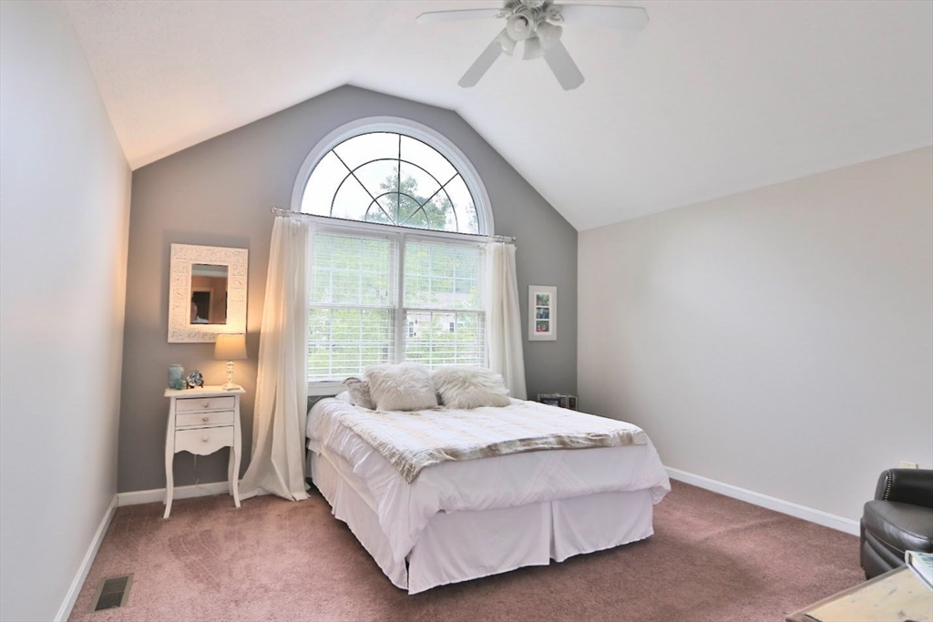 53 Lancaster Road, Unit 7 Clinton, MA 01510 - Photo 13 of 32 a bedroom with a bed and a window