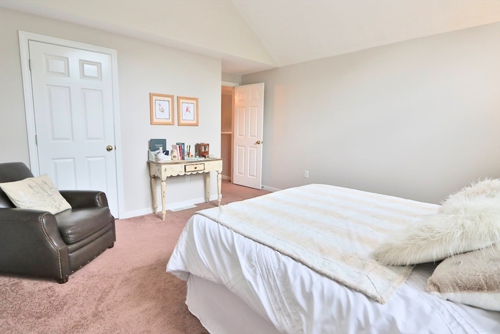 53 Lancaster Road, Unit 7 Clinton, MA 01510 - Photo 15 of 32 a bedroom with a bed and a couch