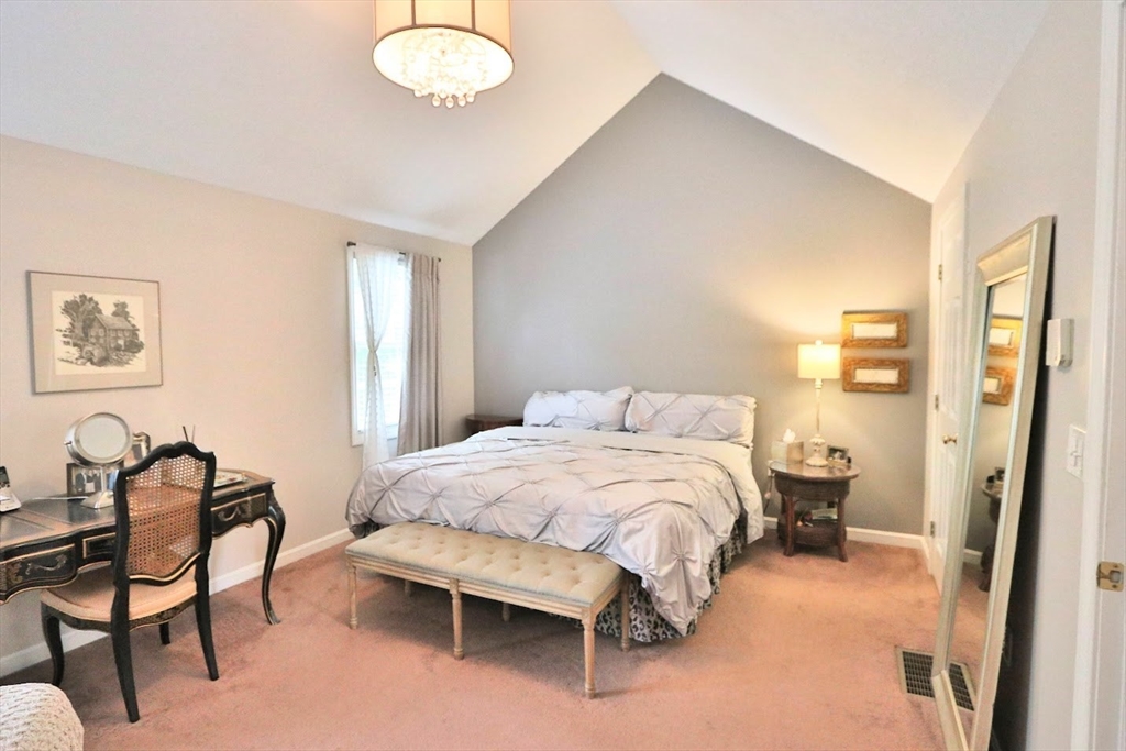 53 Lancaster Road, Unit 7 Clinton, MA 01510 - Photo 16 of 32 a bedroom with a bed and chair