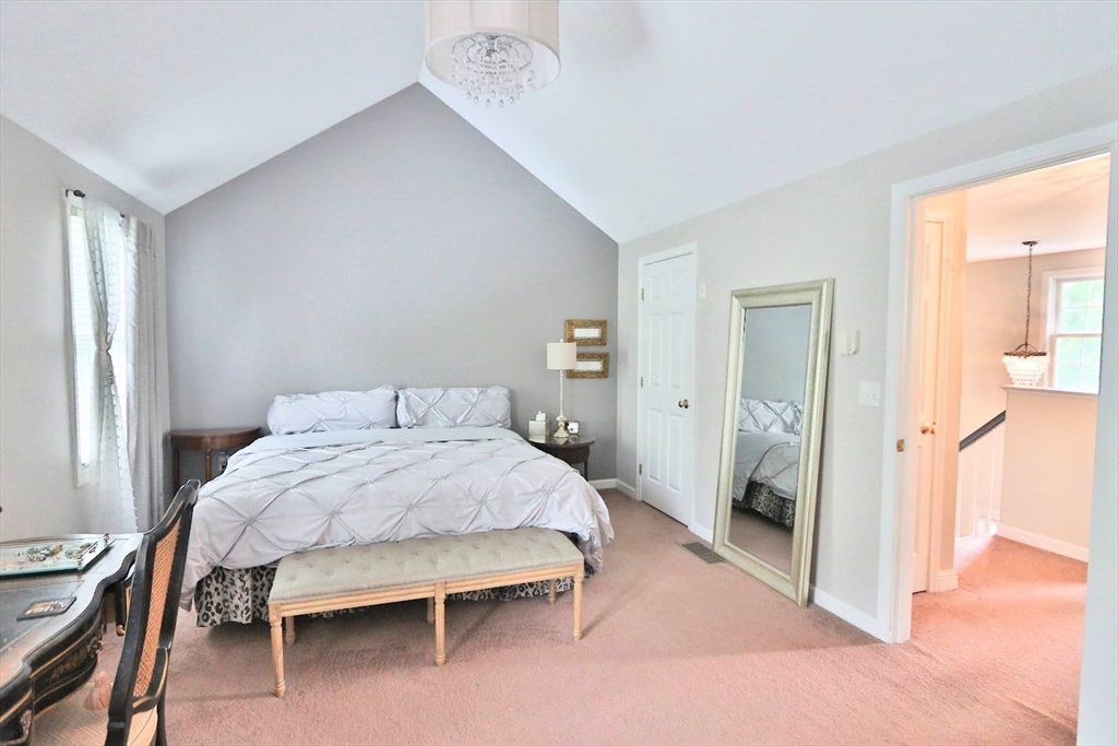 53 Lancaster Road, Unit 7 Clinton, MA 01510 - Photo 18 of 32 a bedroom with a bed and a table