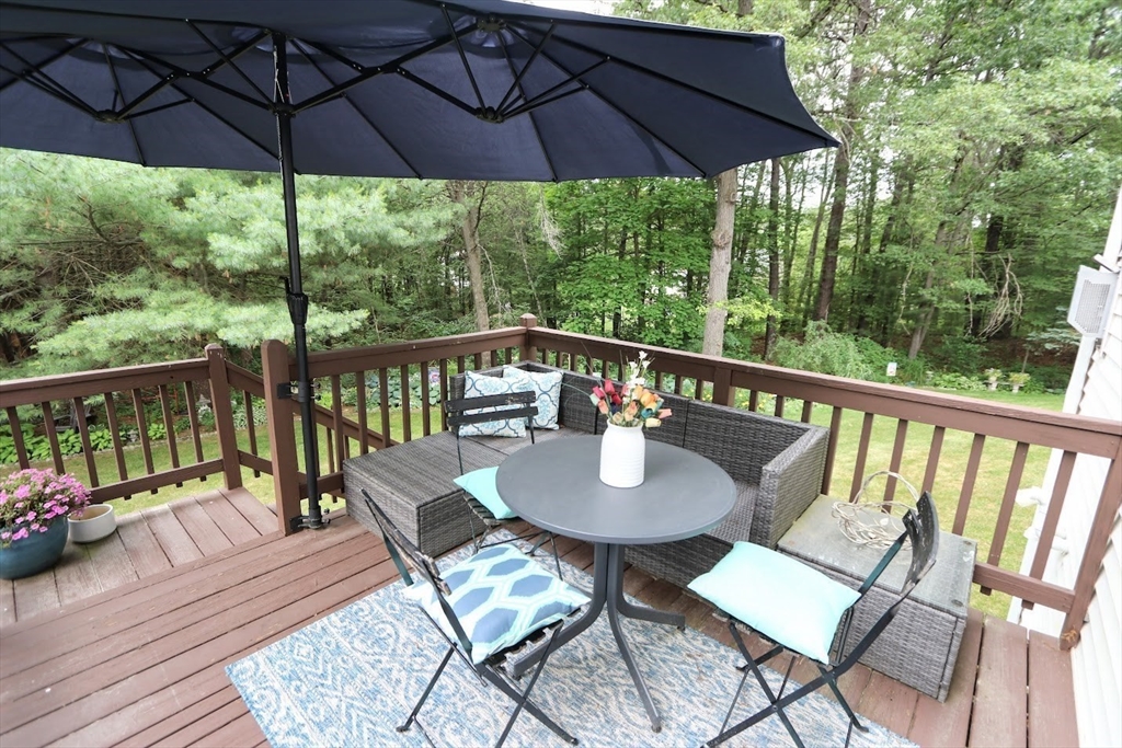 53 Lancaster Road, Unit 7 Clinton, MA 01510 - Photo 22 of 32 a view of balcony with furniture and umbrella