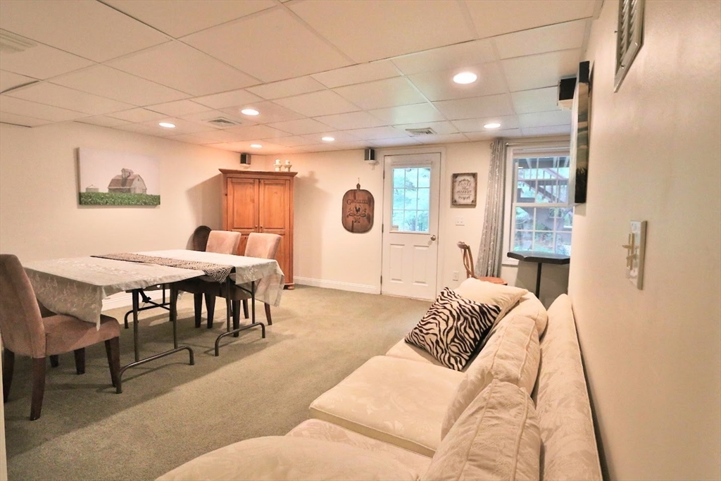 53 Lancaster Road, Unit 7 Clinton, MA 01510 - Photo 26 of 32 a living room with furniture and a large window