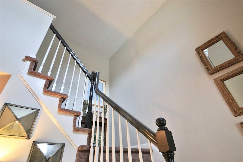53 Lancaster Road, Unit 7 Clinton, MA 01510 - Photo 27 of 32 a view of staircase with wooden floor and white walls