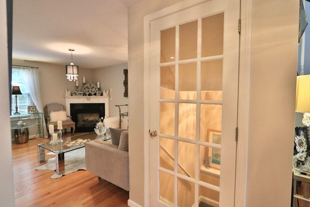 53 Lancaster Road, Unit 7 Clinton, MA 01510 - Photo 29 of 32 a living room with furniture a fireplace and a floor to ceiling window