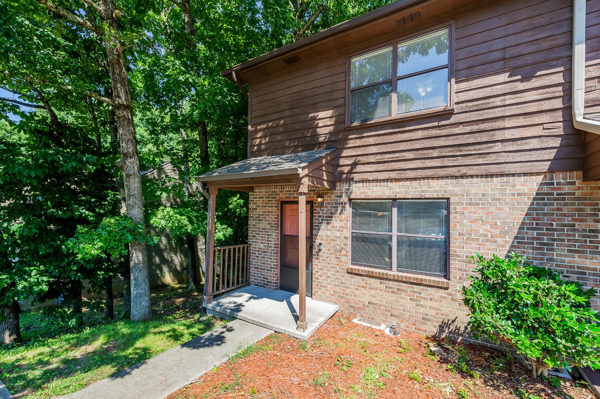 133 High Point Lane Oak Ridge, TN 37830 - Photo 1 of 10 a front view of a house with garden