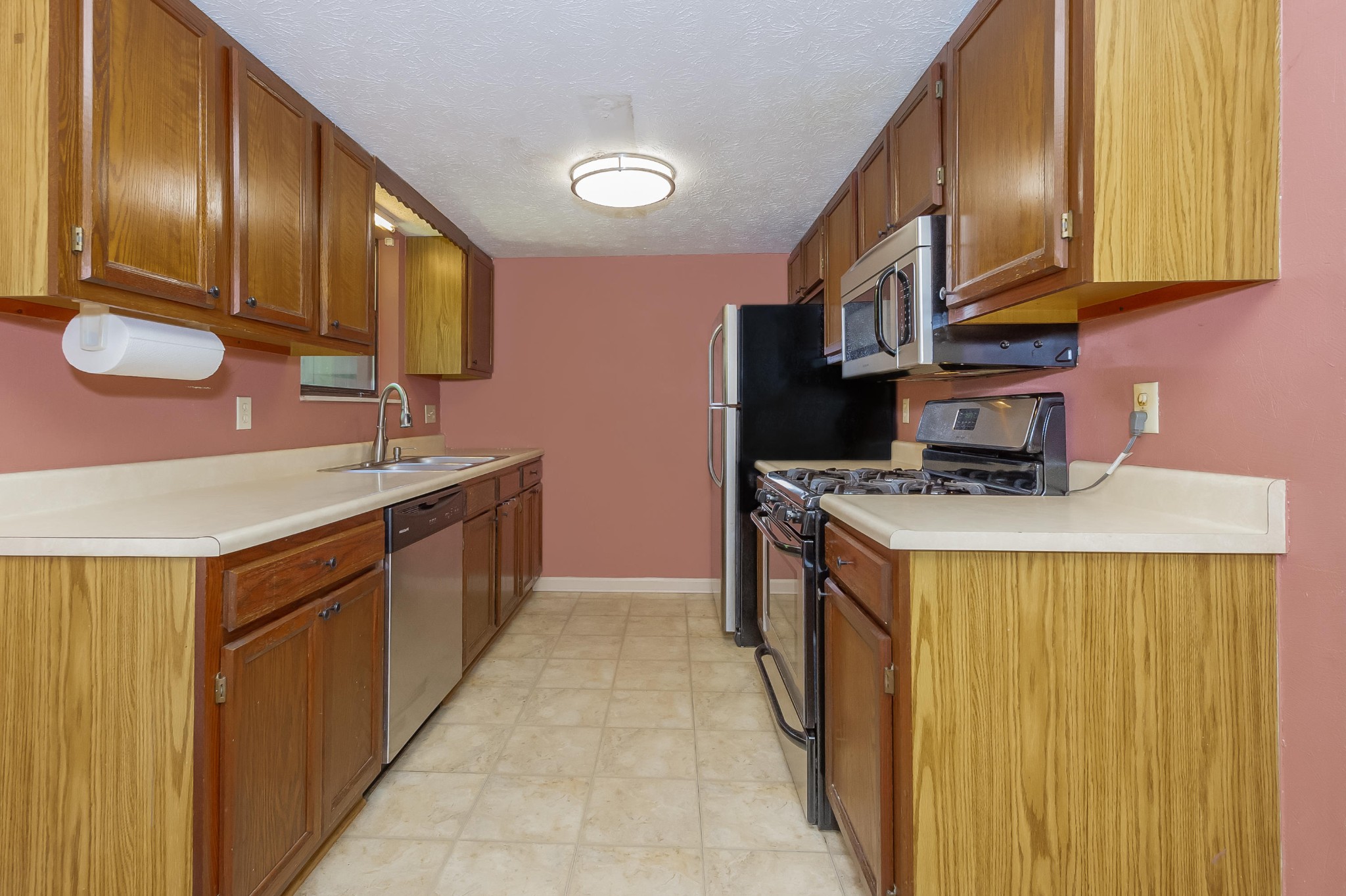 133 High Point Lane Oak Ridge, TN 37830 - Photo 5 of 10 a kitchen with stainless steel appliances granite countertop a sink a stove and a refrigerator