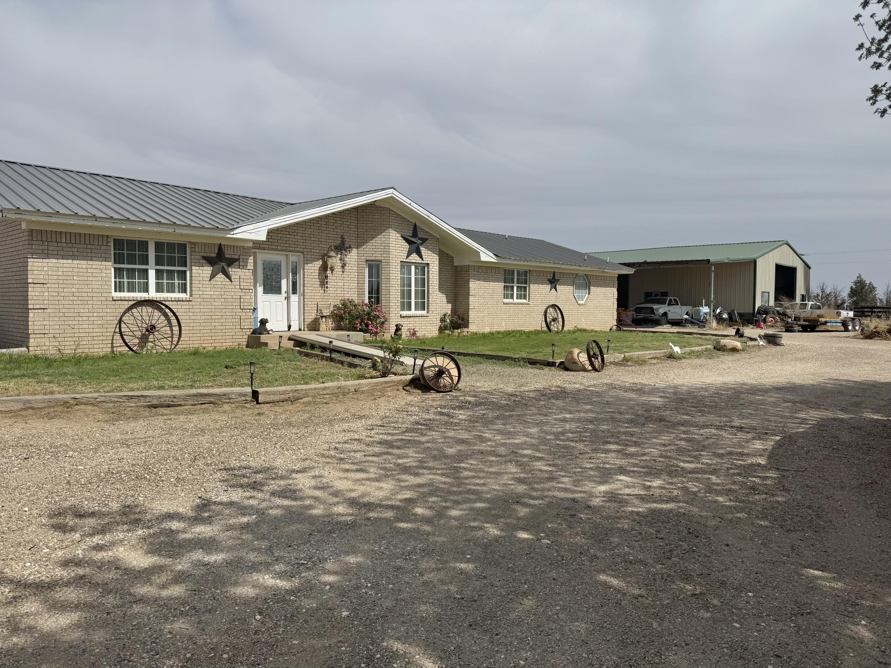 77 Fm1731 Muleshoe, TX 79347 - Photo 1 of 1 a view of a house with large space and a car parked in front of it