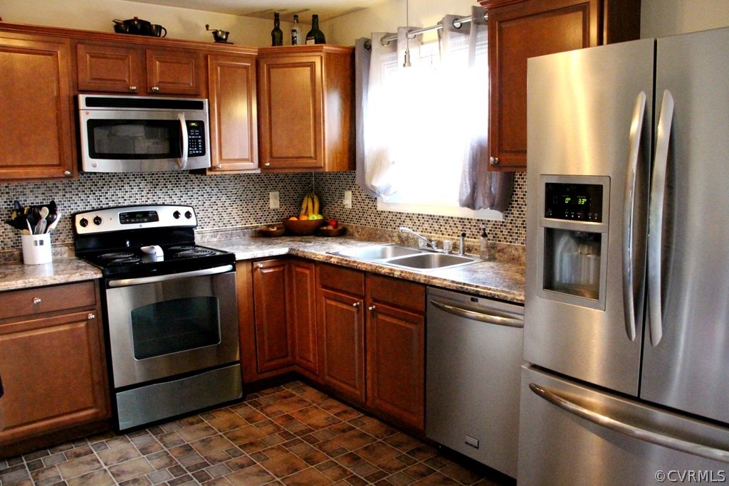 9617 Precedent Road Chesterfield, VA 23832 - Photo 6 of 22 a kitchen with stainless steel appliances granite countertop a refrigerator stove and microwave