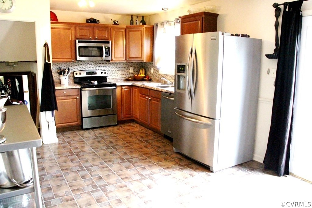 9617 Precedent Road Chesterfield, VA 23832 - Photo 7 of 22 a kitchen with stainless steel appliances a refrigerator stove microwave and sink