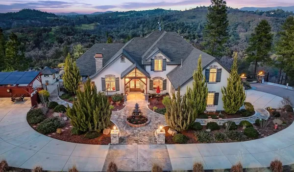 an aerial view of residential house with outdoor space and swimming pool