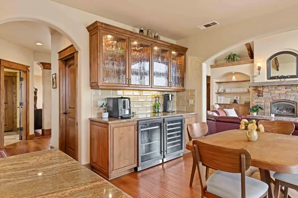 a spacious bathroom with double vanity sinks a mirror and a bathtub