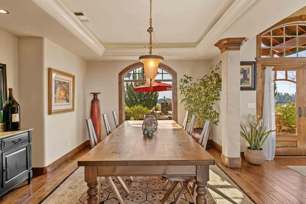 a bedroom with a bed window and a flat tv screen