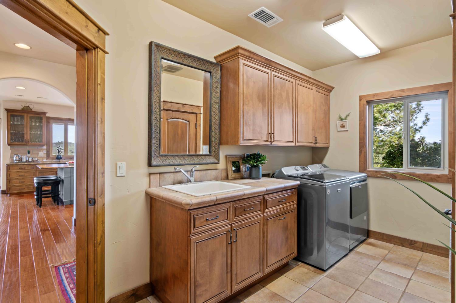 5390 Lost Creek Road Shingle Springs, CA 95682 - Photo 26 of 81 Laundry room is off of the garage, for great access to the kitchen.