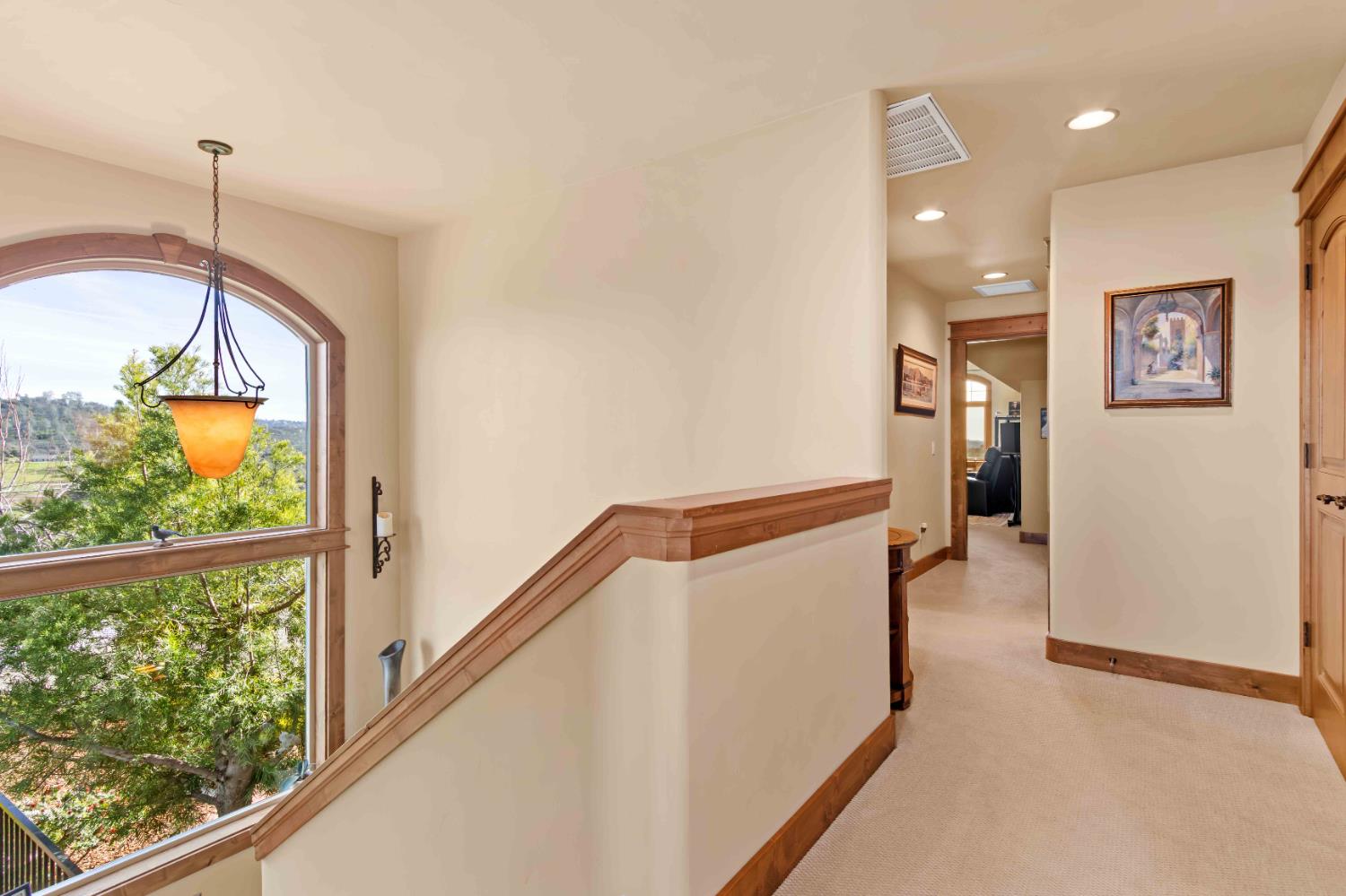 5390 Lost Creek Road Shingle Springs, CA 95682 - Photo 27 of 81 The stairway's landing window provides stunning views.