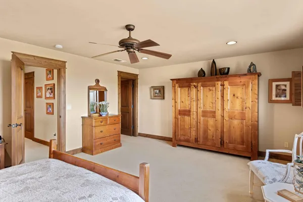 an aerial view of a house with a yard swimming pool and mountains