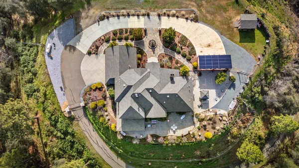 a living room with fireplace furniture and a large window