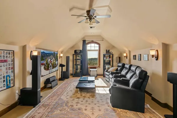 a living room with furniture a table and a flat screen tv