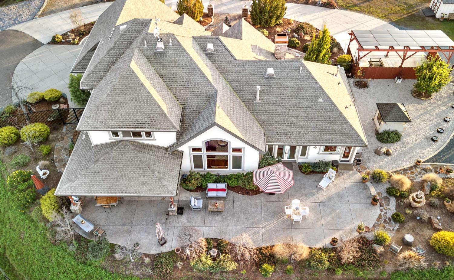 5390 Lost Creek Road Shingle Springs, CA 95682 - Photo 45 of 81 Overview of the back patio. Solar is on the carport to the right.
