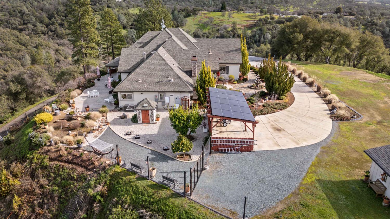 5390 Lost Creek Road Shingle Springs, CA 95682 - Photo 46 of 81 Carport with solar is on center of this photo.