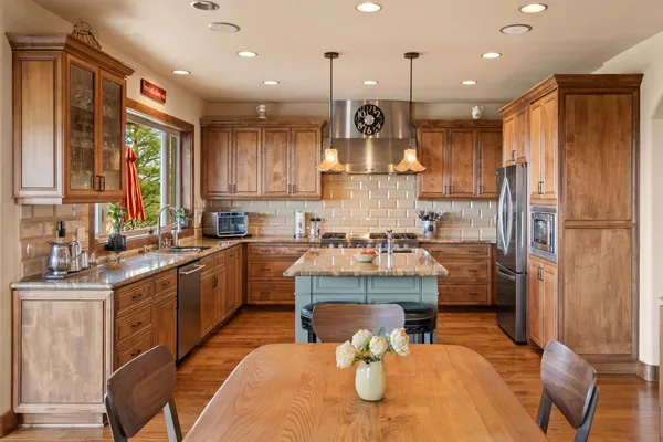 a view of living room filled with furniture and wooden floor