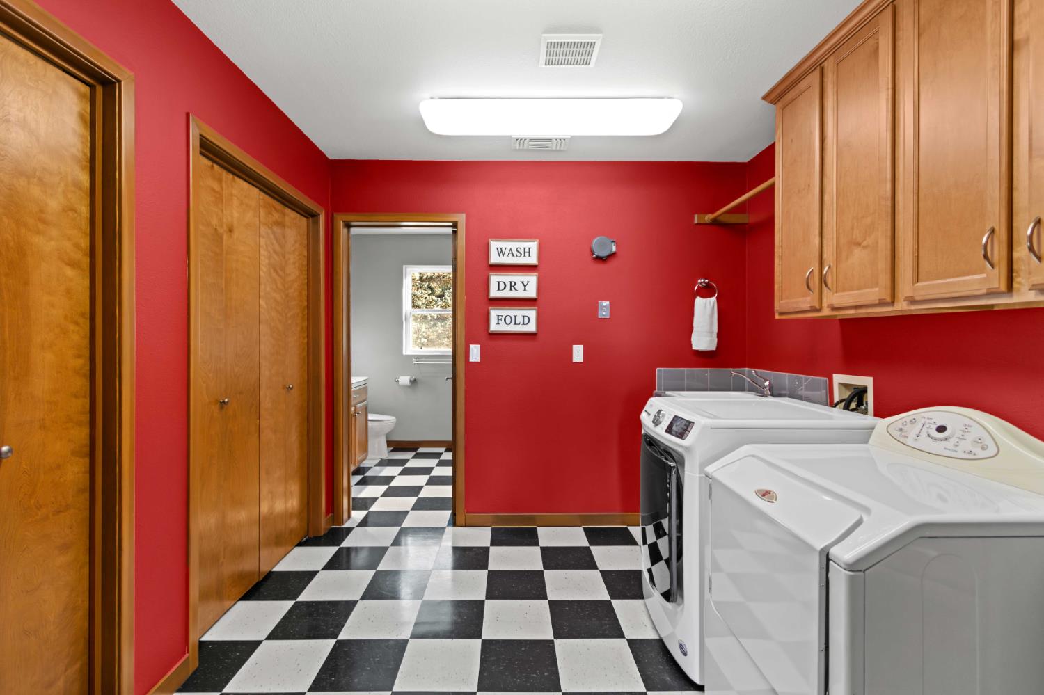 5390 Lost Creek Road Shingle Springs, CA 95682 - Photo 62 of 81 Laundry room, storage, and full bathroom on main level off of garage.