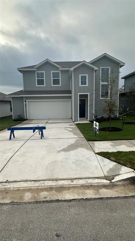 204 Inks Lane Kyle, TX 78640 - Photo 2 of 25 A newly constructed residence features a crisp facade and attached garage, ready for new occupants.