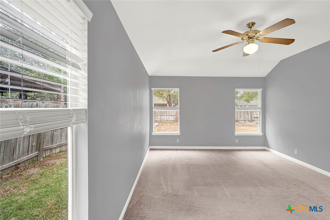 140 Riley Cove Kyle, TX 78640 - Photo 16 of 26 a view of livingroom with window and ceiling fan