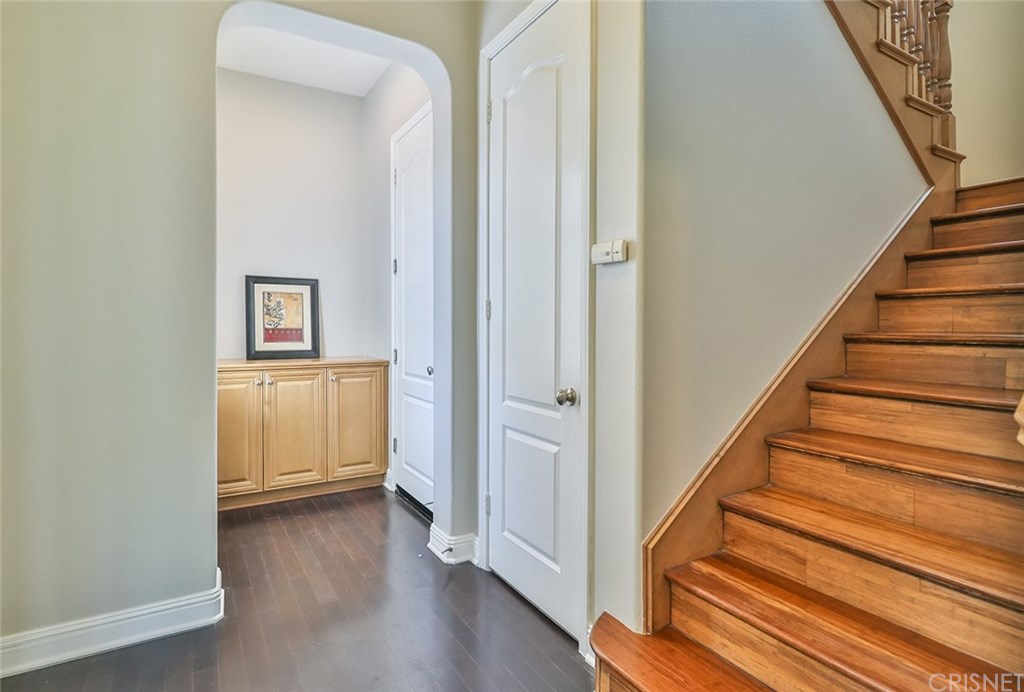 2948 Milestone Avenue Simi Valley, CA 93065 - Photo 39 of 70 Hard bamboo flooring on the steps and upstairs. Door to the garage and one to a large storage under the staircase