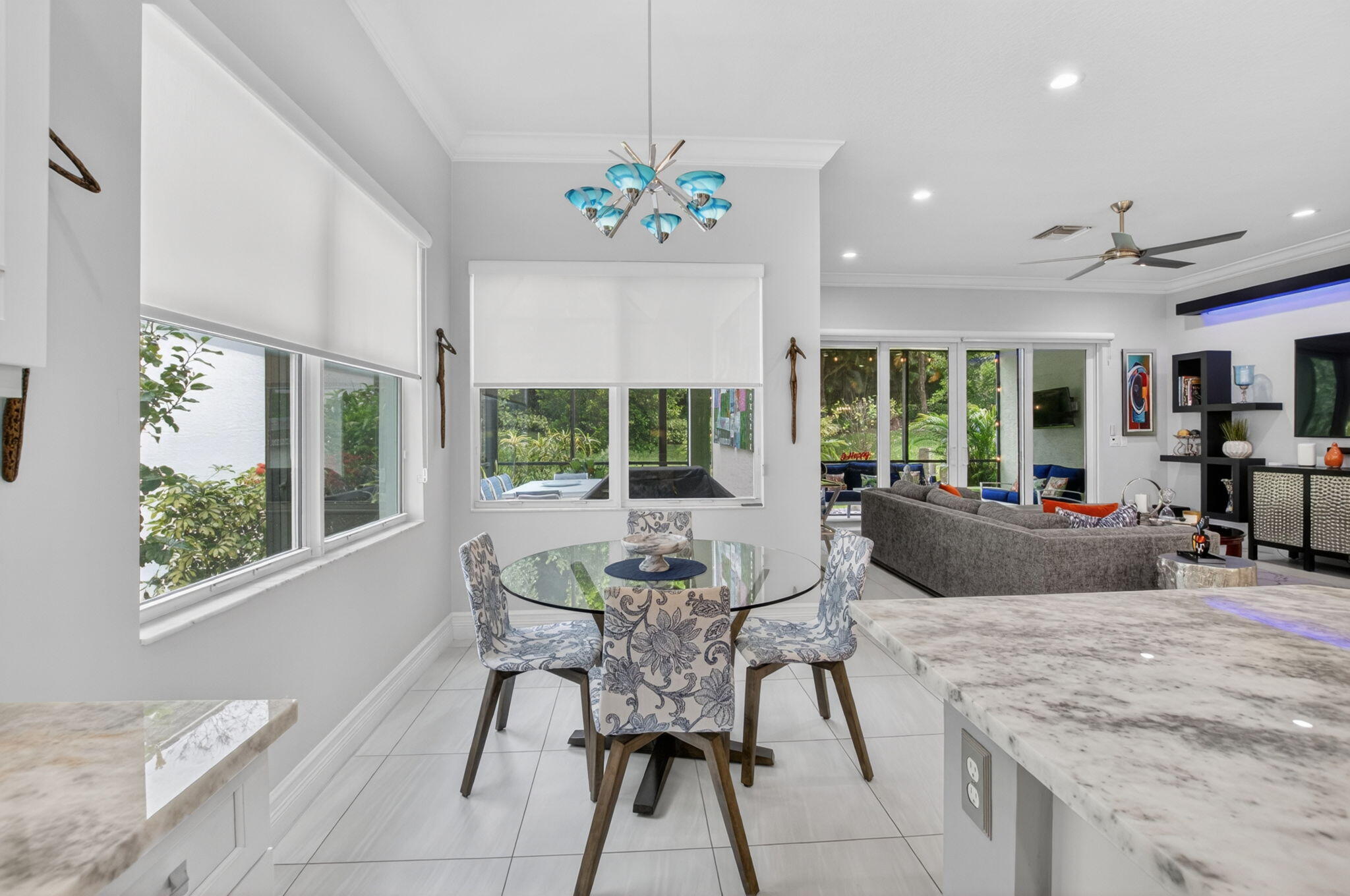 8263 Arabian Range Road Boynton Beach, FL 33473 - Photo 22 of 52 a dining room with furniture a chandelier and wooden floor