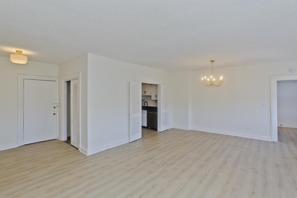 140 Chestnut Street, Unit 404 Springfield, MA 01103 - Photo 2 of 15 a view of empty room with wooden floor