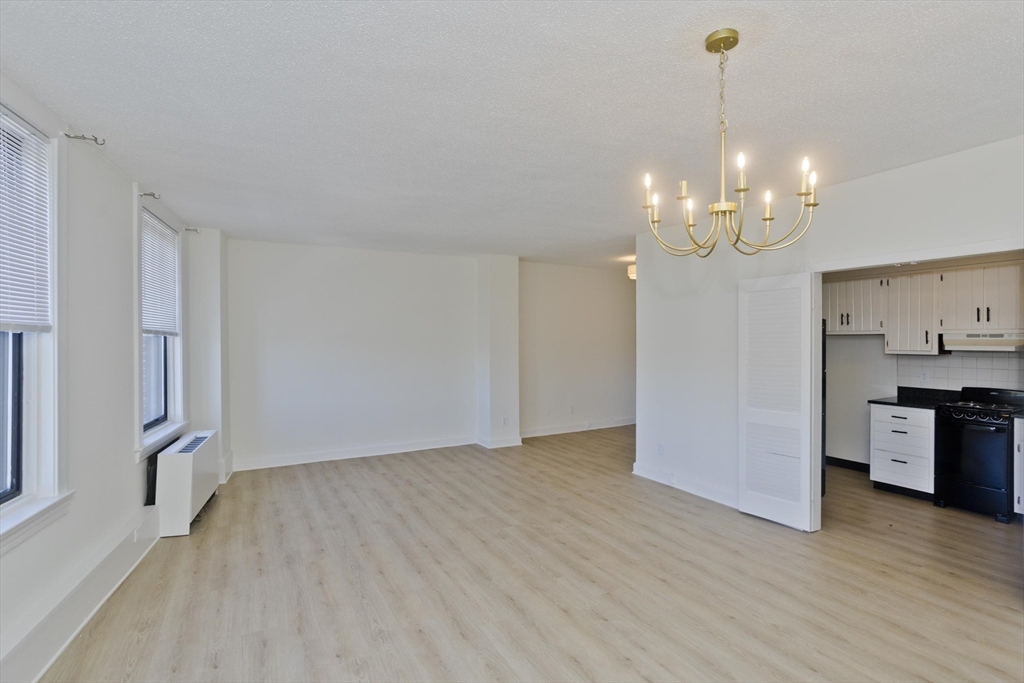 140 Chestnut Street, Unit 404 Springfield, MA 01103 - Photo 6 of 15 a view of a kitchen with stove and refrigerator