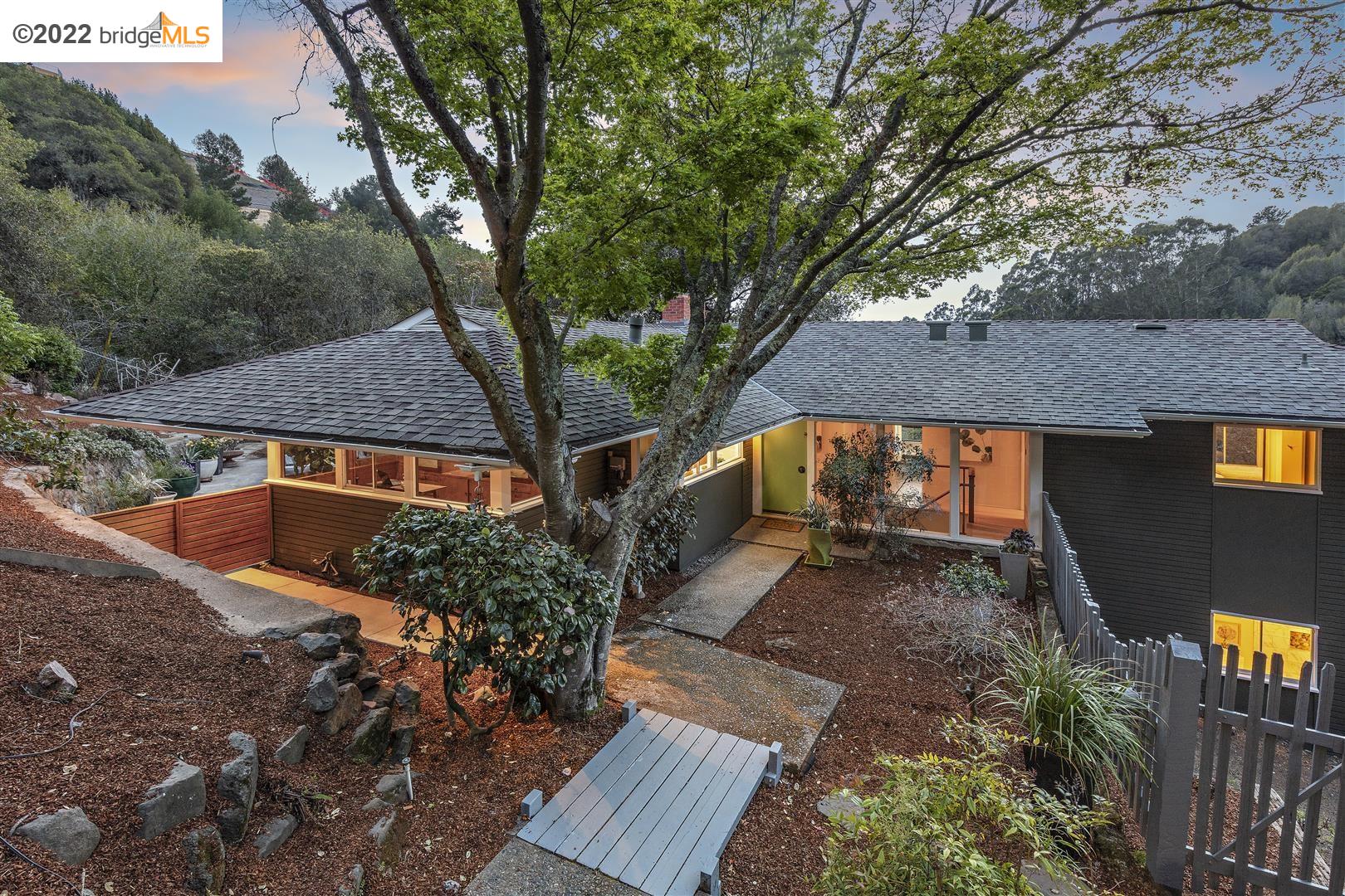 55 Gypsy Lane Berkeley, CA 94705 - Photo 1 of 1 a backyard of a house with wooden floor and large trees