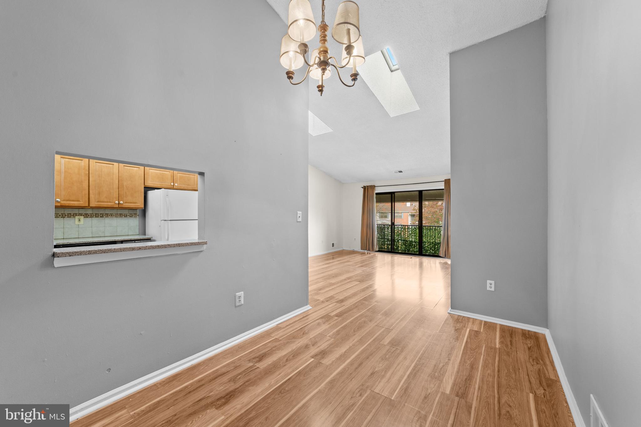 21 Kite Court Lawrenceville, NJ 08648 - Photo 11 of 30 a view of an empty room with wooden floor and a window