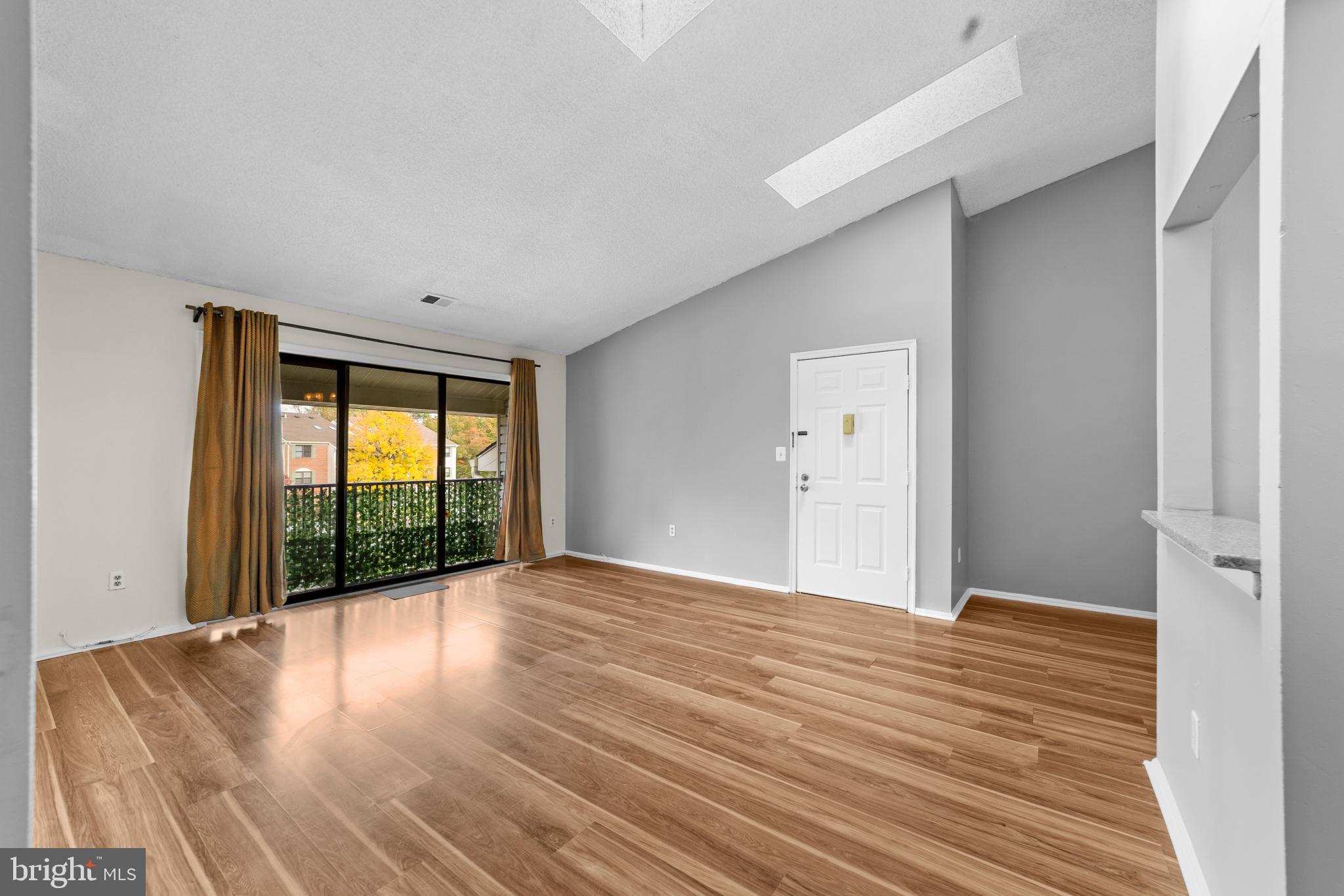 21 Kite Court Lawrenceville, NJ 08648 - Photo 14 of 30 a view of an empty room with wooden floor and a window