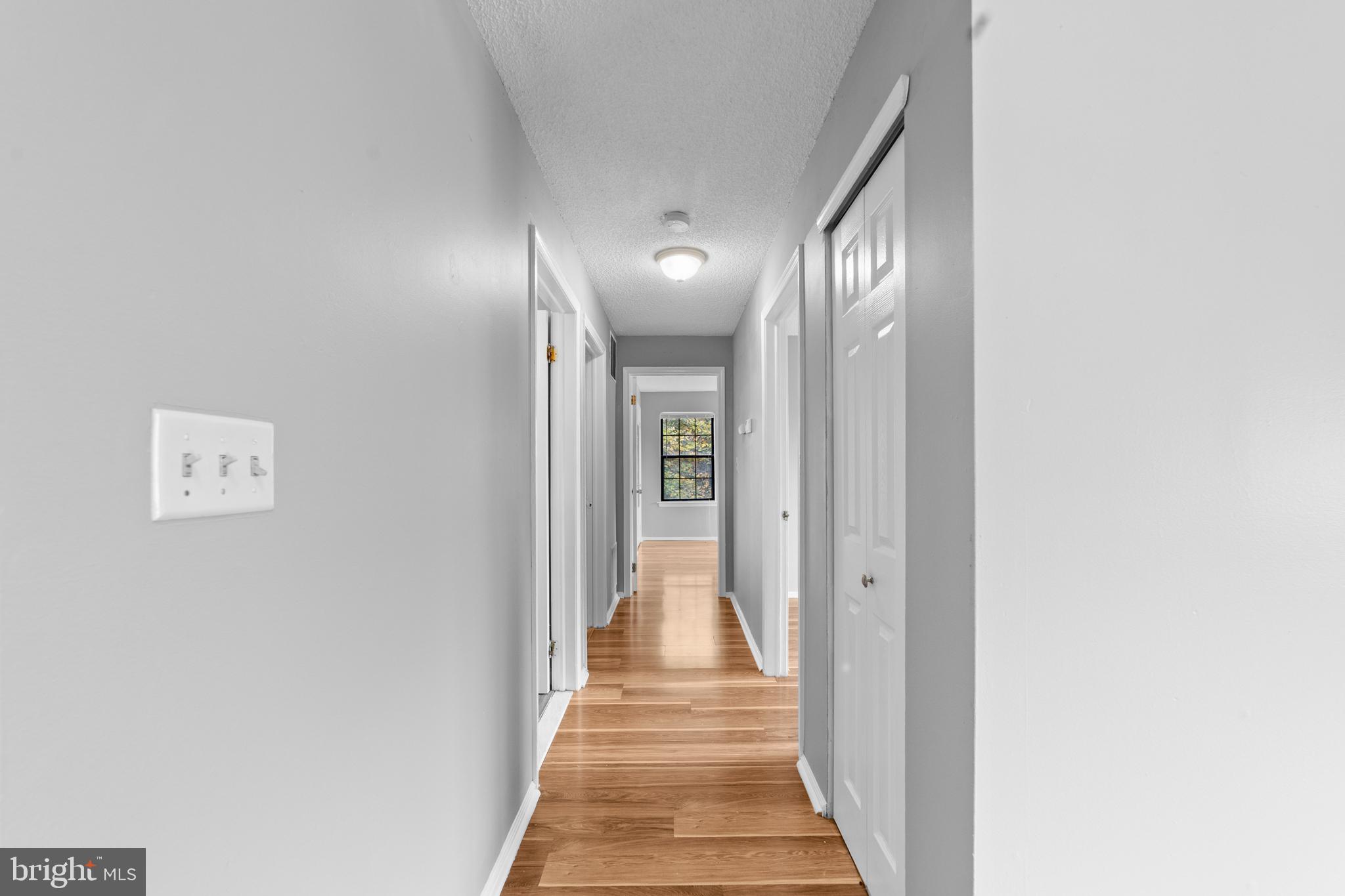 21 Kite Court Lawrenceville, NJ 08648 - Photo 17 of 30 a view of a hallway with wooden floor