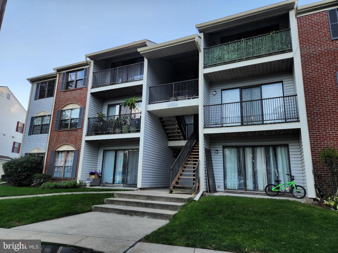 21 Kite Court Lawrenceville, NJ 08648 - Photo 2 of 30 a front view of a house with a yard