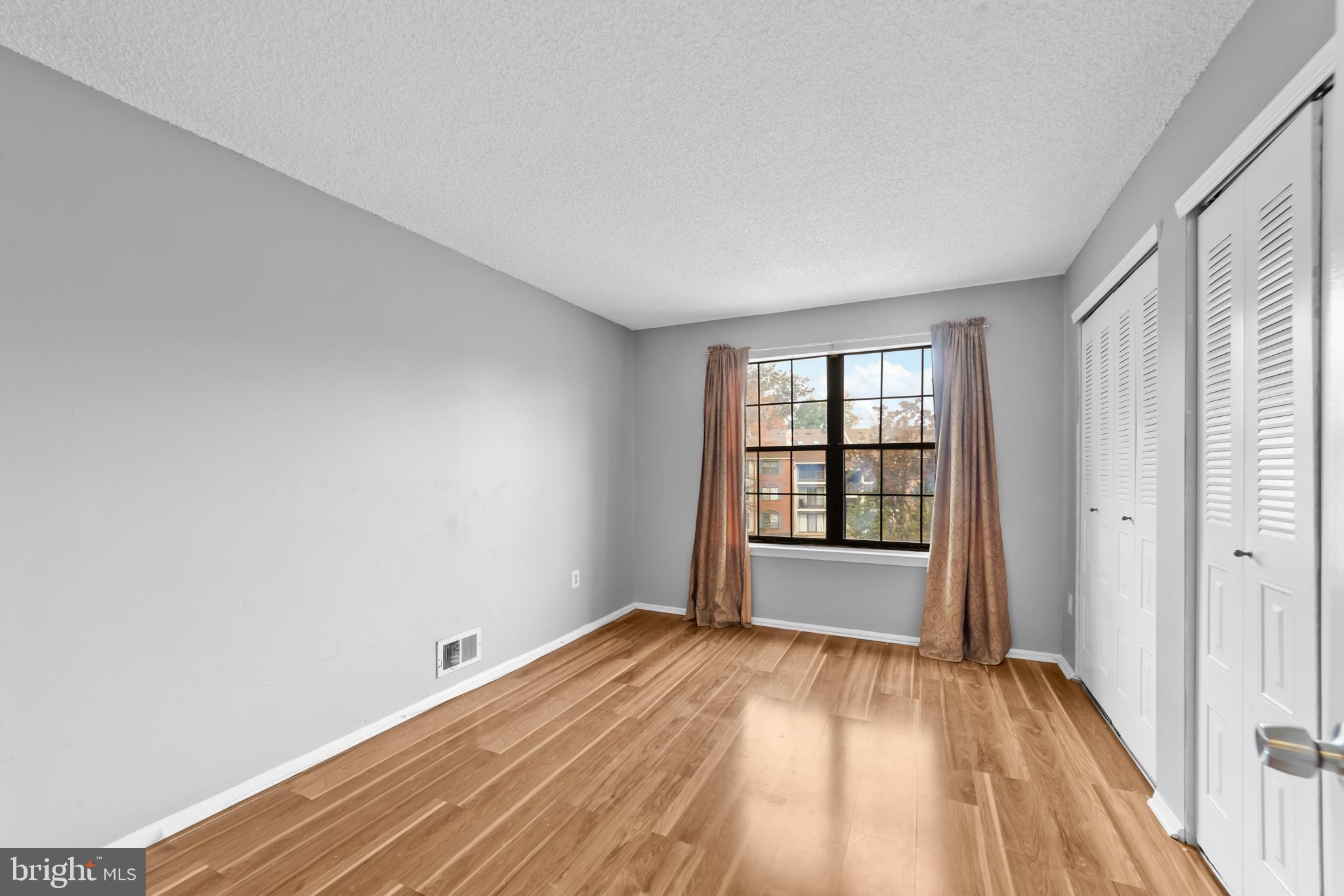 21 Kite Court Lawrenceville, NJ 08648 - Photo 21 of 30 wooden floor in an empty room with a window
