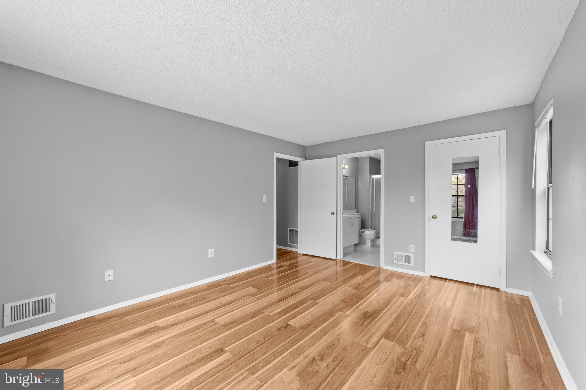 21 Kite Court Lawrenceville, NJ 08648 - Photo 27 of 30 a view of an empty room with wooden floor and a window