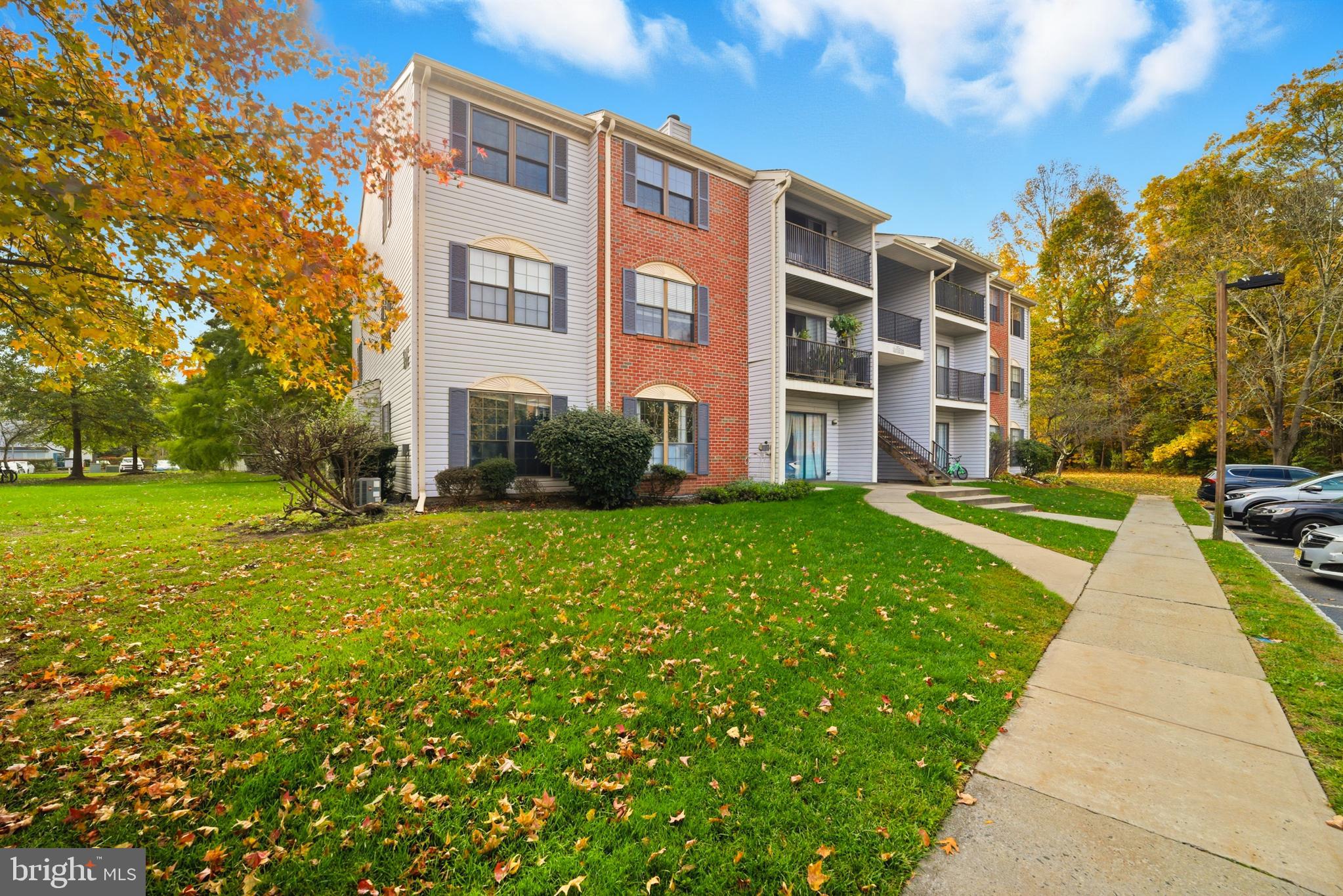 21 Kite Court Lawrenceville, NJ 08648 - Photo 4 of 30 a view of a building with a yard