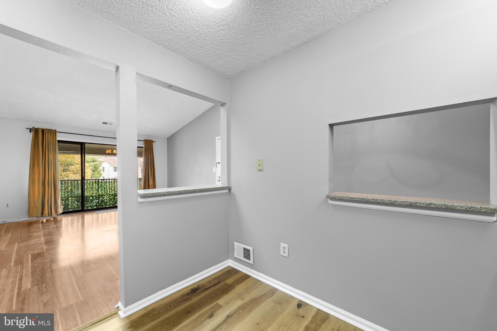 21 Kite Court Lawrenceville, NJ 08648 - Photo 7 of 30 a view of empty room with wooden floor and fan
