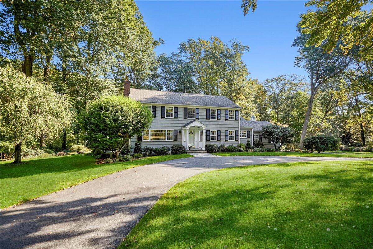 110 Ridge Acres Road Darien, CT 06820 - Photo 1 of 30 a view of a house with a big yard and large trees