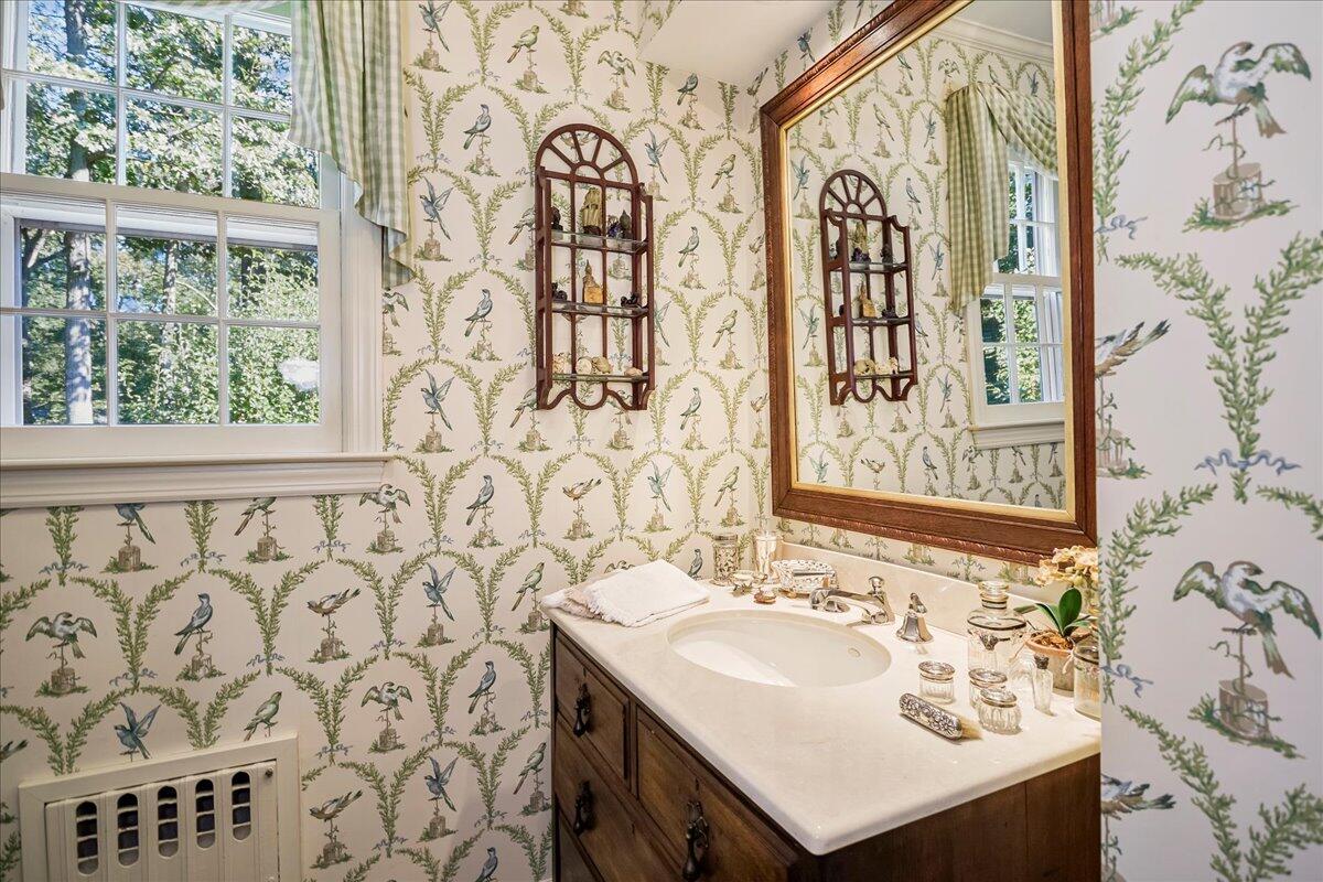 110 Ridge Acres Road Darien, CT 06820 - Photo 17 of 30 a bathroom with a sink and a mirror
