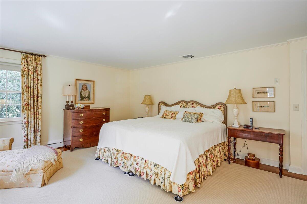 110 Ridge Acres Road Darien, CT 06820 - Photo 18 of 30 a bedroom with a bed and wooden floor
